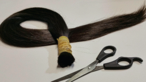 A bundle of dark-brown hair wrapped at the top.